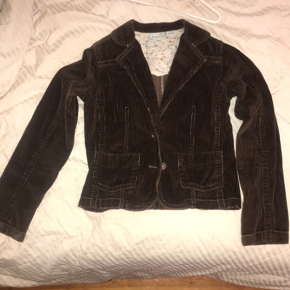 Brown stripped jacket with floral print on the inside of the neck area.